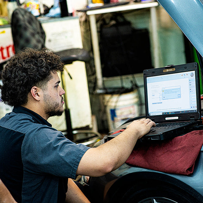 Mechanic using durabook laptop to program vehicle