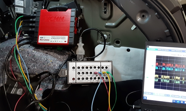 Ford enhanced breakout box in use with laptop and the VCMM.