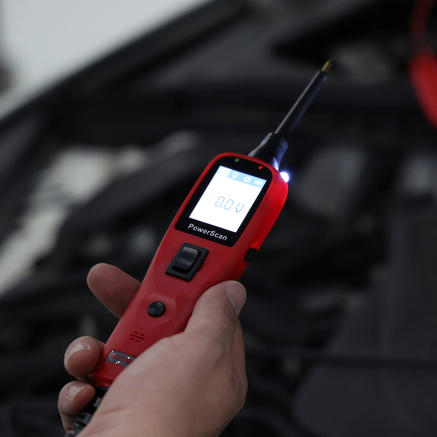 Technician using the MS100 to test voltage.
